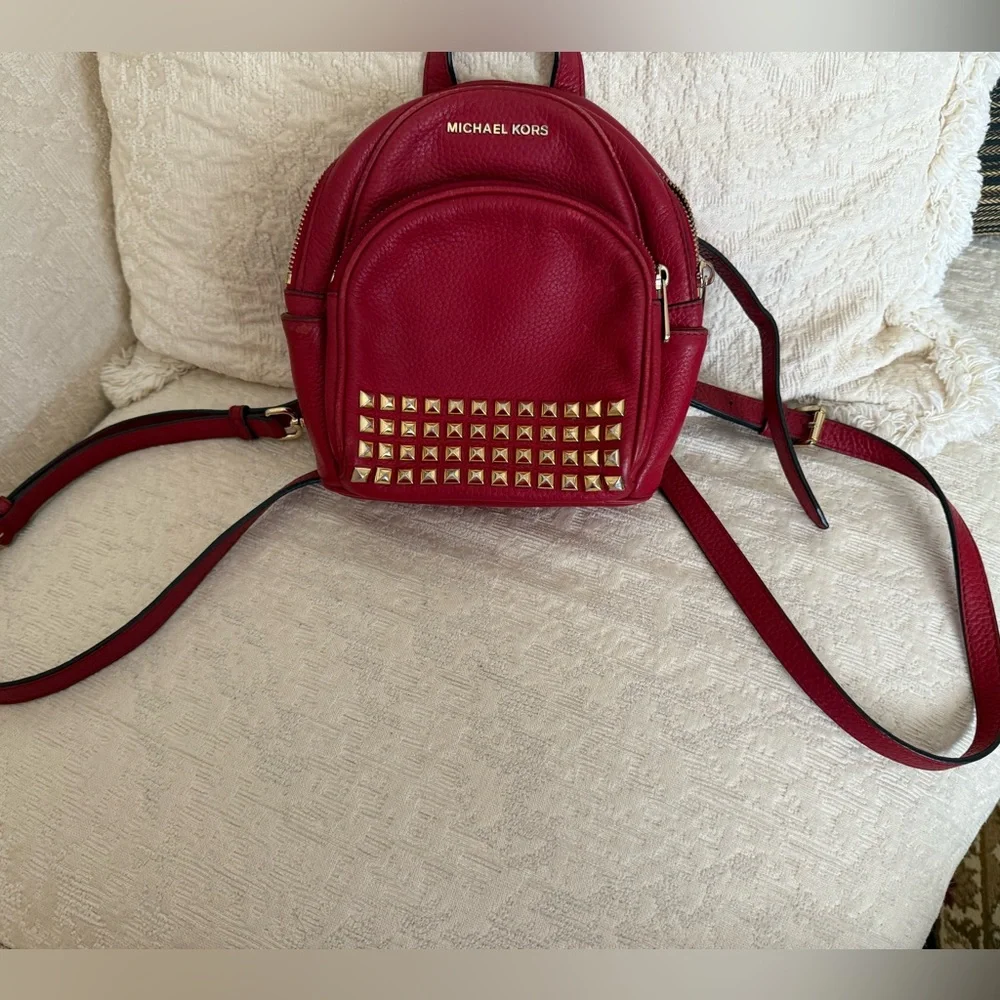 Michael Kors Abbey XS Studded Red Backpack with Gold Studs
Size 7 by 8 by 3 - Picture 15 of 16